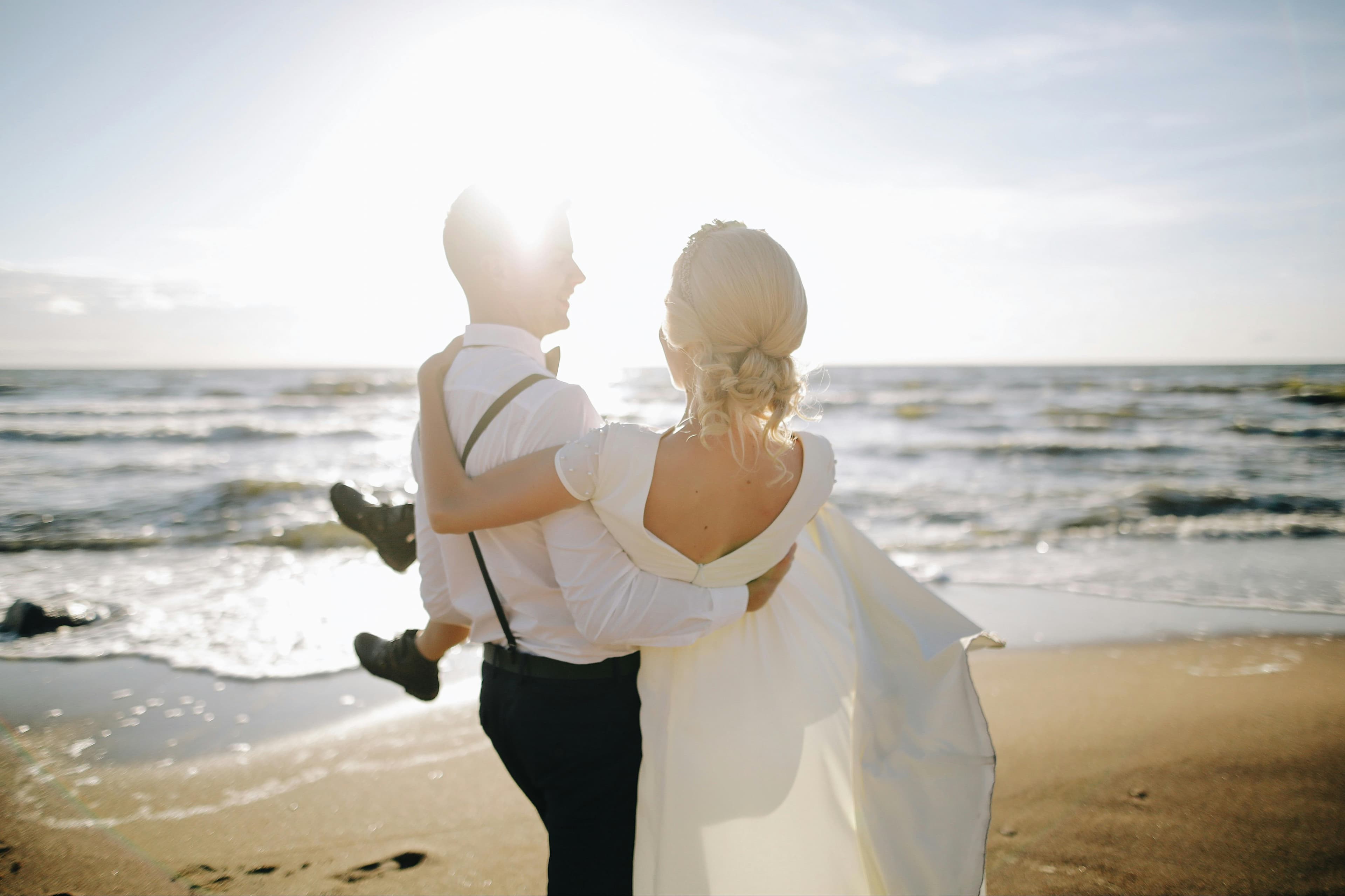 Couple eloping on a secluded Cyprus beach at golden hour